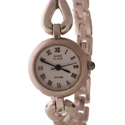 Sterling Silver Anne Klein Watch. The Watch Has A Round White Face And A Square Linked Thin Band.