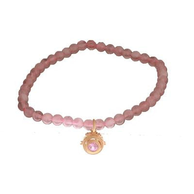 Trendy Rose Quartz Beaded Style Bracelet With Sterling Silver With 14K Yellow Gold Overlay Charm Hanging. The Charm Contains A Round Pink Stone In The Center. This Bracelet Can Be Worn With Various Fashion Co