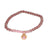Trendy Rose Quartz Beaded Style Bracelet With Sterling Silver With 14K Yellow Gold Overlay Charm Hanging. The Charm Contains A Round Pink Stone In The Center. This Bracelet Can Be Worn With Various Fashion Co