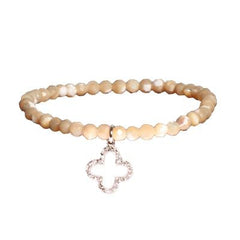 Trendy  Simulated Pearl Beaded Style Bracelet. The Bracelet Contains A Sterling Silver Clover Shaped Cut Out Cz Charm Hanging. This Bracelet Can Be Worn With Fashion Various Colors And Charms From This Collect