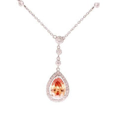 Stylish Brass With Rhodium Overlay Drop Style 16 Inch Necklace With A 2 Inch Extender. The Necklace Contains Cz Stones Along Chain And Has A Pear Shaped Champagne Stone Hanging.