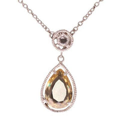 Dainty Sterling Silver With Rhodium Overlay Drop Style Necklace. The Necklace Contains Round Bezel Set Cz Stones Along Chain And Has A Pear Shaped Yellow Stone Hanging With Rope Trimming Around.