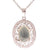 Trendy Sterling Silver With Rhodium Overlay Oval Shaped Cut Out Design Pendant With Jade Stone In Center And Clear Cubic Zirconium Stones Around.