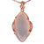 Trendy Sterling Silver With Rose Gold Overlay Drop Style Pendant With White Chalcedony Stone In Center And Cubic Zirconium Stones Around. Matching Earrings Available.