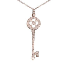 Designer Inspired Trendy Sterling Silver With Rhodium Overlay Key Pendant. The Pendant Contains A Round Top Part With A Clover Cut Out In Center With .05Ct X 16 Round Clear Cubic Zirconium Stones Around And