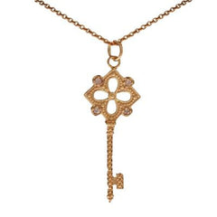 Designer Inspired Dainty Sterling Silver With 14K Yellow Gold Overlay Key Pendant. The Pendant Contains .01Ct X 4 Round Clear Cubic Zirconium Stones And Has A Clover Shaped Cut Out In Center With Roped Style