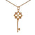 Designer Inspired Dainty Sterling Silver With 14K Yellow Gold Overlay Key Pendant. The Pendant Contains .01Ct X 4 Round Clear Cubic Zirconium Stones And Has A Clover Shaped Cut Out In Center With Roped Style