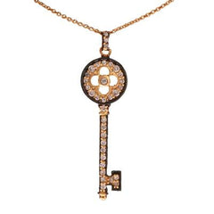 Designer Inspired Dainty Two Tone 14K Yellow Gold And Black Rhodium Overlay Key Pendant. The Pendant Contains A Round Top With A Clover Shaped Cut Out In Center And .002Ct X 12 Round Clear Cubic Zirconium St