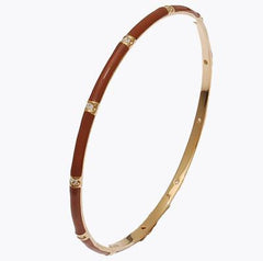 Designer Inspired Brass With A 14K Gold Overlay And Brown Enamel Bangle. Round Cubic Zirconia'S Throughout Bangle. Matching Ring Available. Rhodium Plated To Prevent Tarnishing.