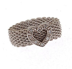 Beautiful Brass With A Rhodium Overlay Ring. Adorable Heart In Center Of Ring With Mesh Design Band. Rhodium Plated To Prevent Tarnishing.